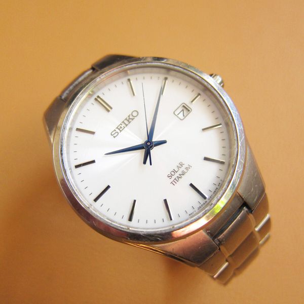 SEIKO V157-0BB0 Full Titanium Solar Menâ€™s Watch w/ White Dial