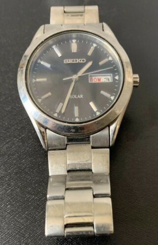 seiko silvertone black dial solar calendar watch