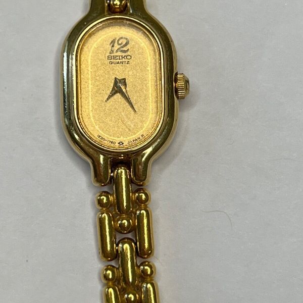 648- Vintage Ladies SEIKO Gold Tone Petite Bracelet Watch, 1E20