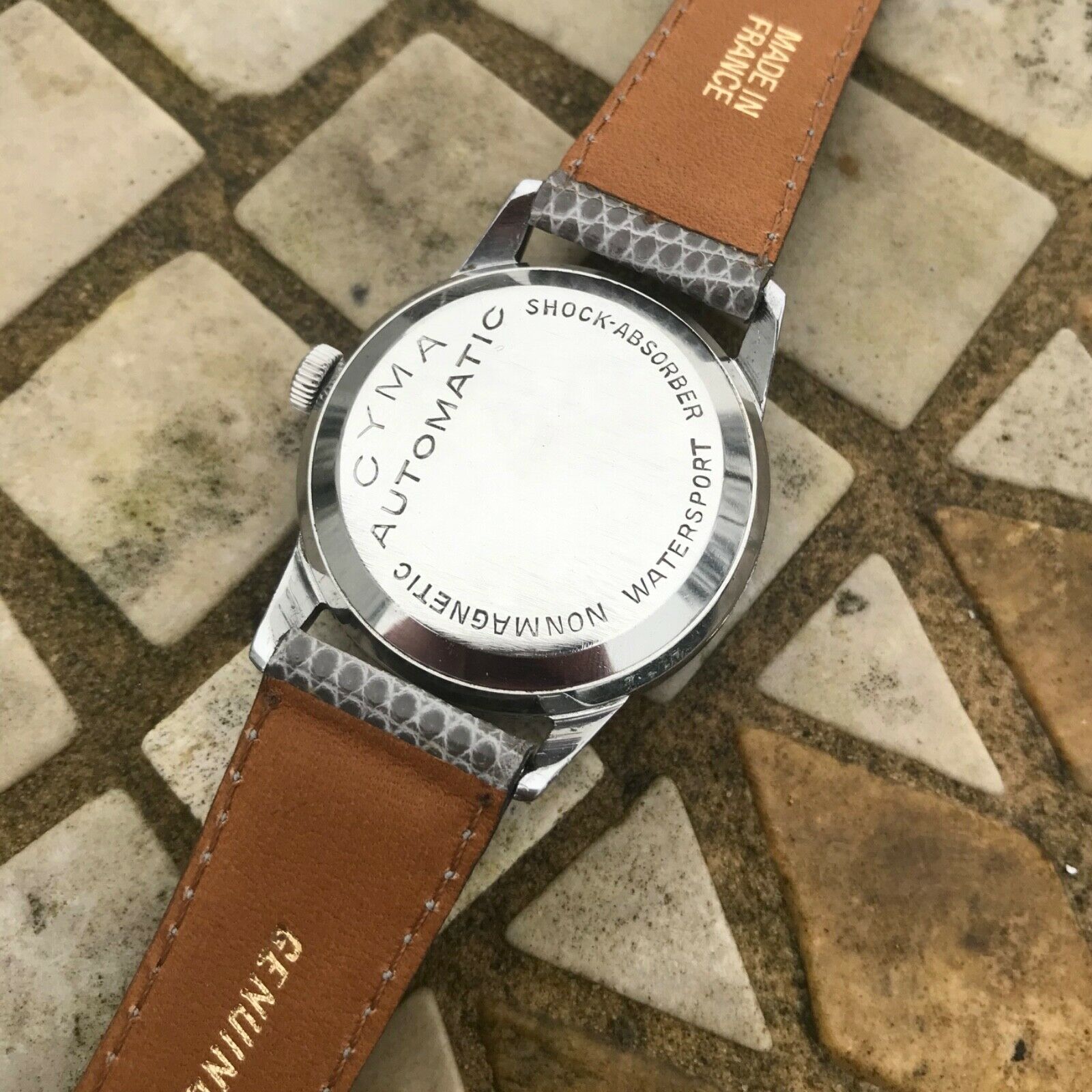 Stunning vintage 1940's Cyma automatic shock absorber gilt dial