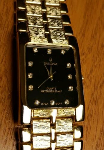 Bulova water resistant 18k gold outlet watch