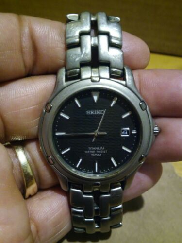 Seiko 7N32 0069 Mens 50m All Titanium Analog Quartz Watch Needs