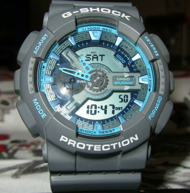 Casio G Shock GA 110TS 5146 Wrist Watch for Men Grey and Turquoise Free Gift WatchCharts Marketplace