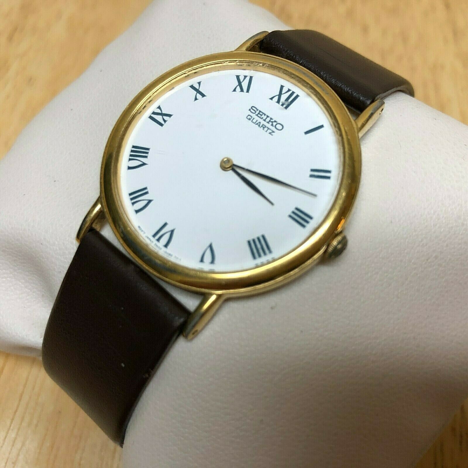 Vintage Seiko 7N00-8A00 Mens Slim Roman Analog Quartz Watch Hours 