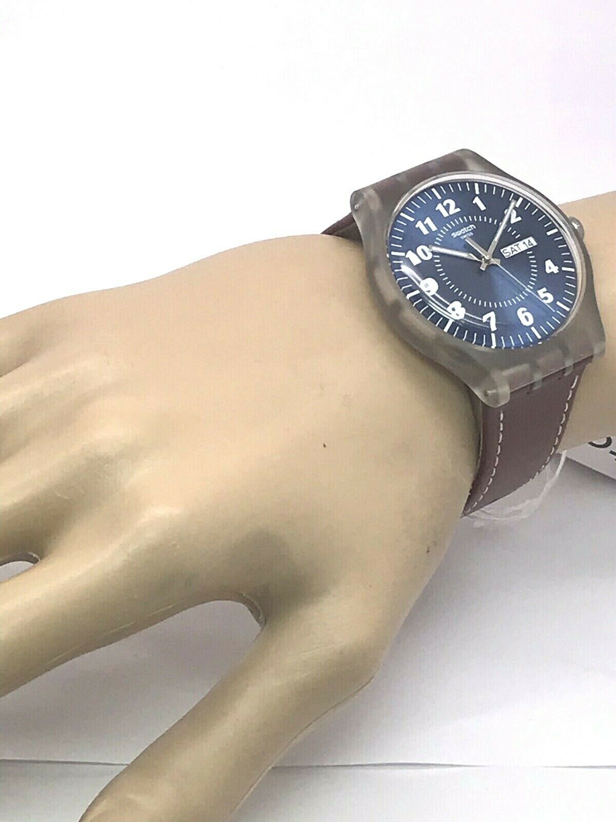 Swatch Originals VENT BRULANT Brown Leather Date Swiss Men's Watch 41mm  SUOK709 | WatchCharts