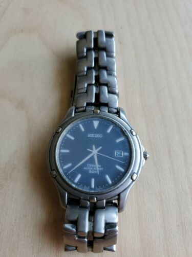 Seiko 7N32 0069 Mens 50m All Titanium Analog Quartz Watch Hours