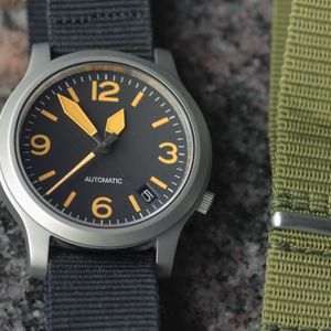 SOLD: Yobokies Seiko 5 Mod: looks like Sinn 656 w/ orange lume/black dial:   | WatchCharts