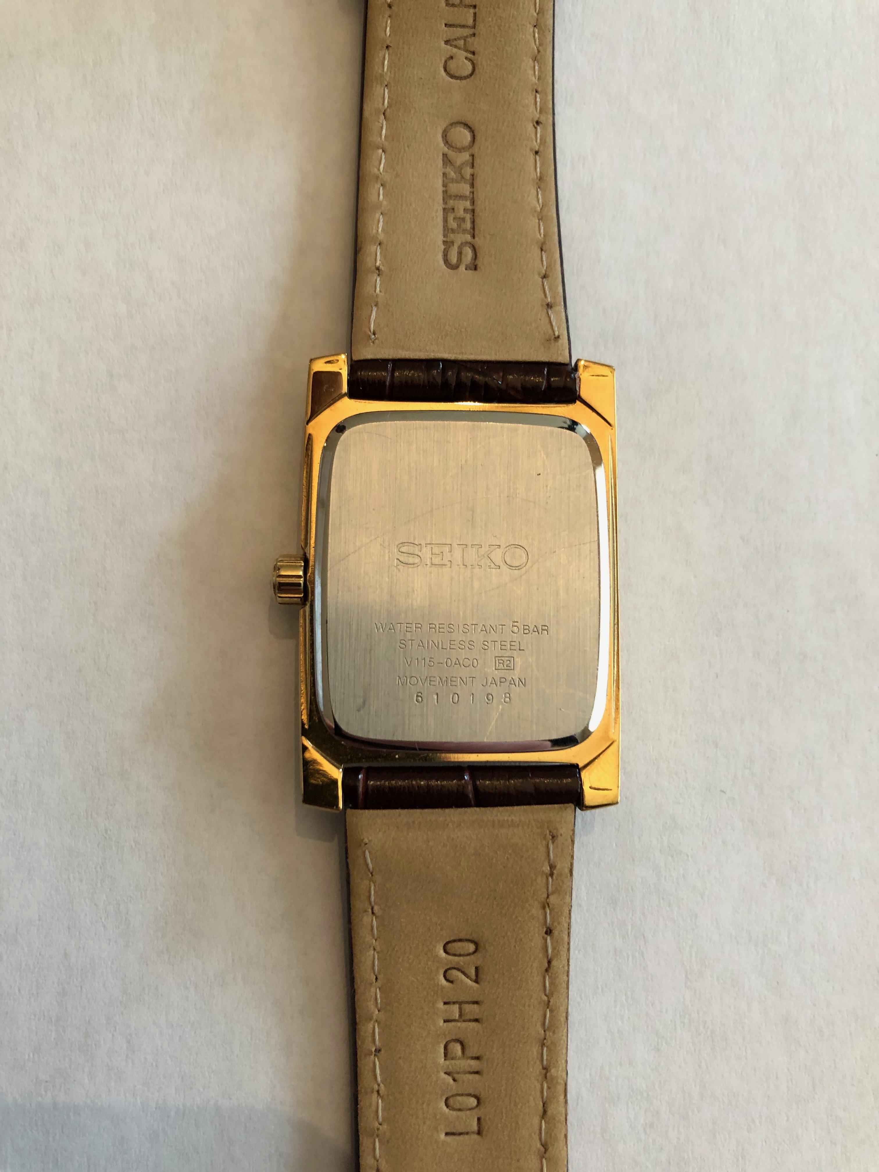 WTS Seiko SUP896 gold tone solar quartz Tank style dress watch