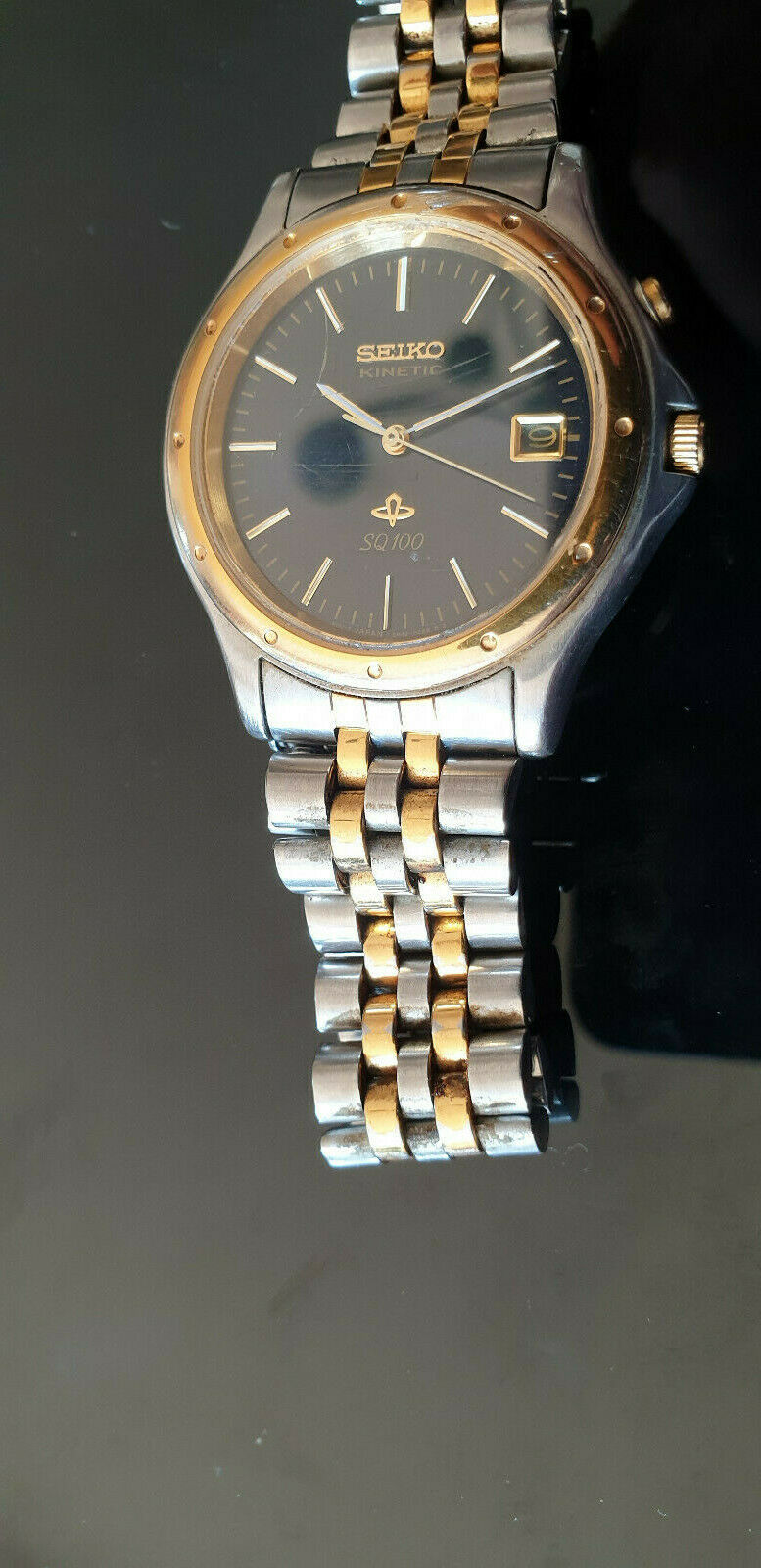 Seiko Kinetic SQ100 - 5M42-OB50 Black Face, two tone strap