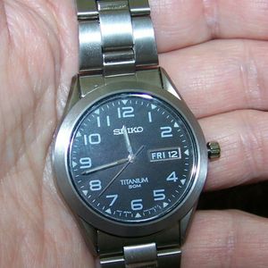 Seiko Quartz Black Dial Watch with 37mm Titanium Case & Folded Bracelet # SGG711 | WatchCharts
