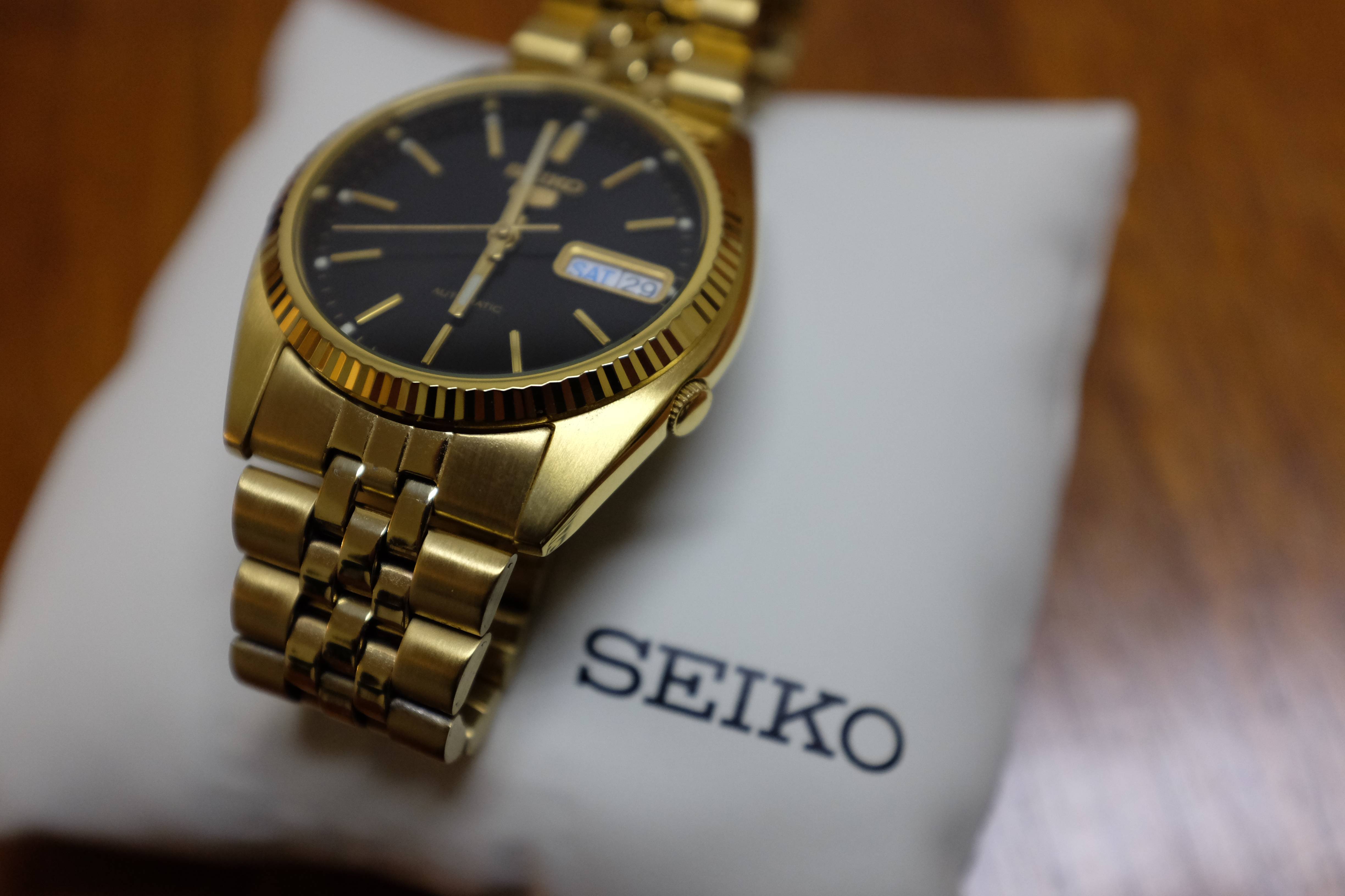 seiko 5 gold black dial