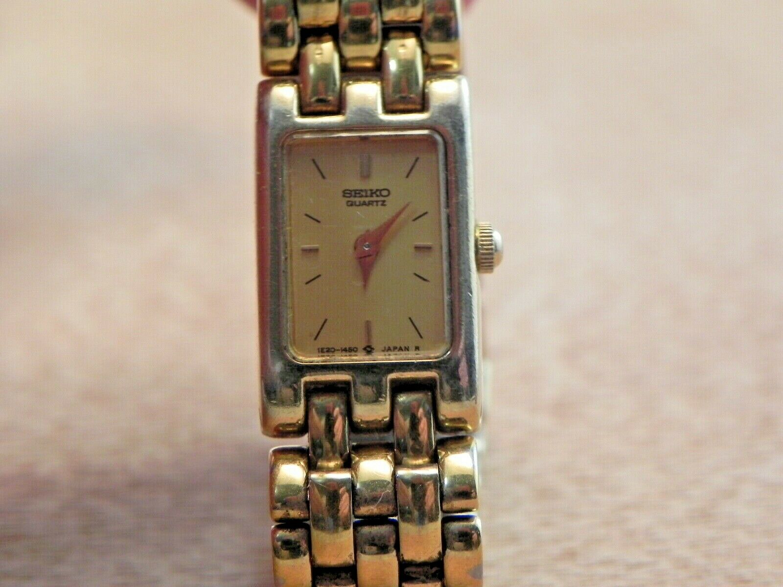 Woman's Seiko 1E20-5839 Dress Wrist Watch-New Battery-Gold Tone