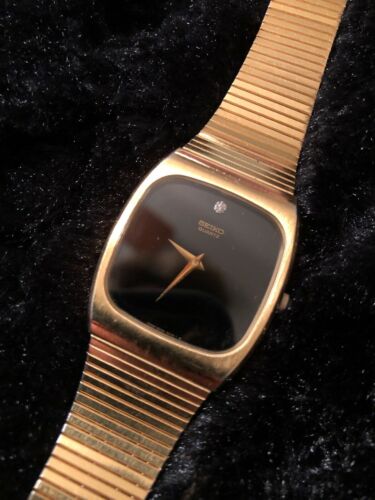 seiko gold watch black face