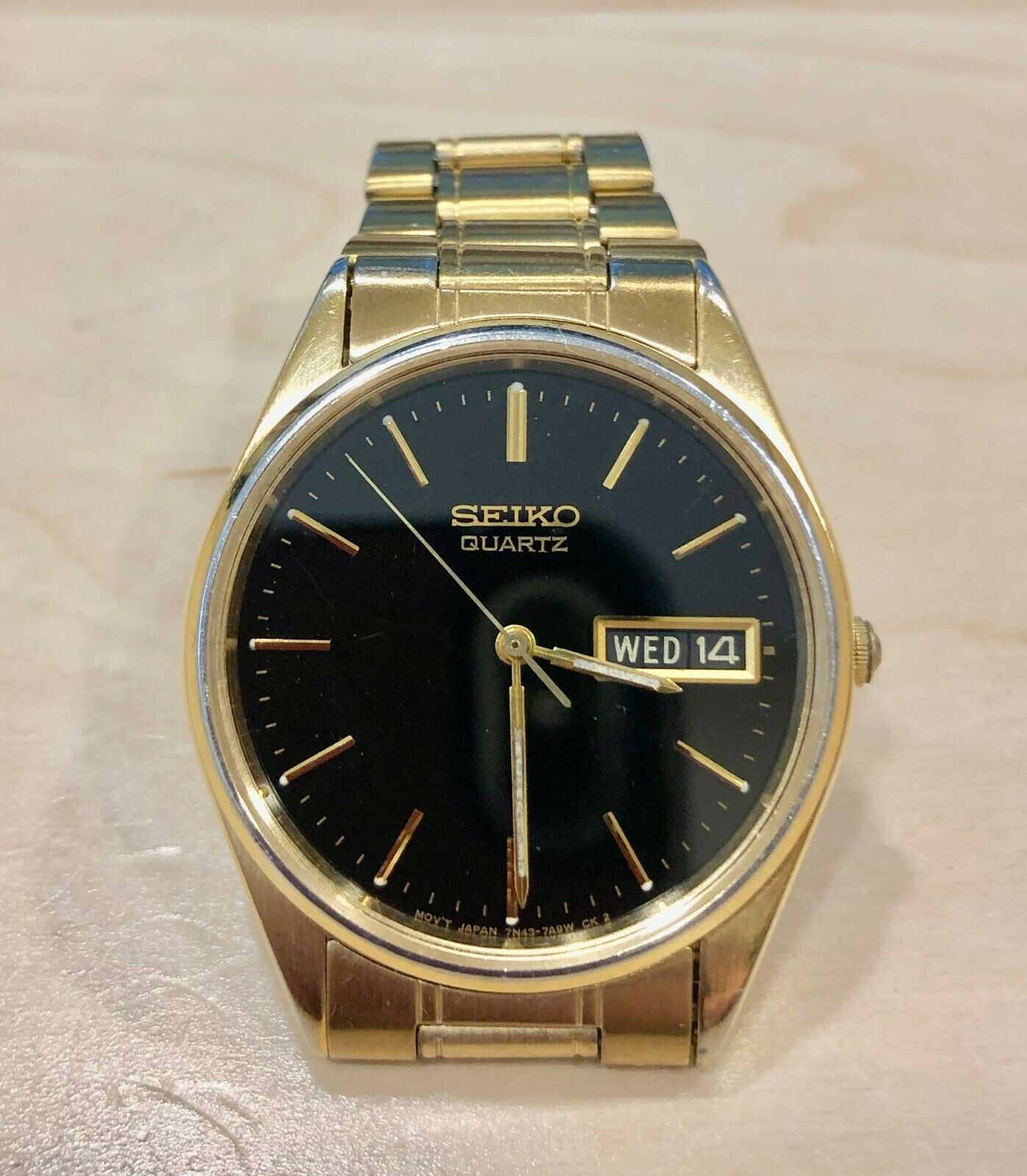 Gents Seiko Quartz 7N43-7A50 Gold tone case black dial | WatchCharts