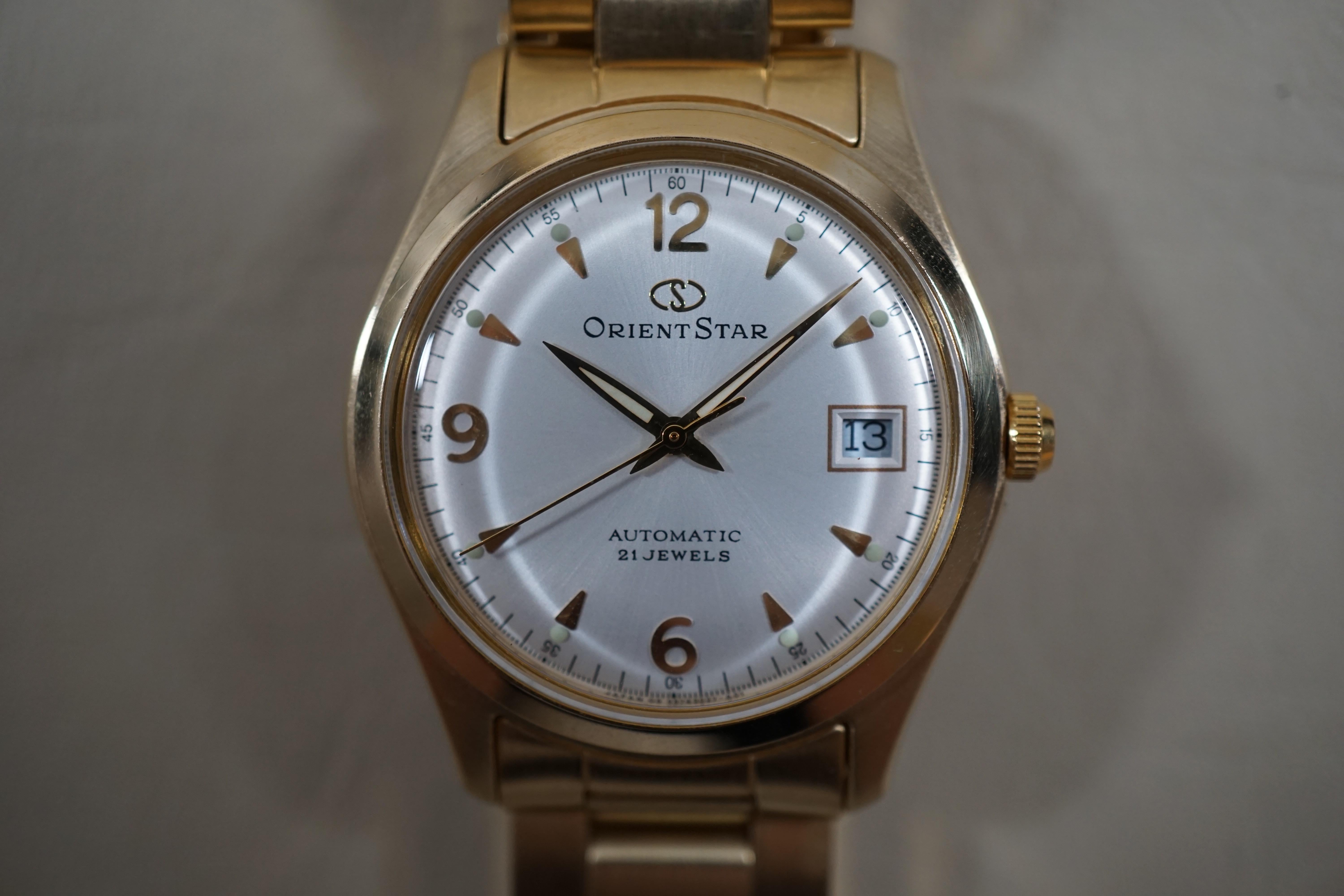 WTS Orient Star PF00 A0 CS Gold Tone Silver Dial Explorer