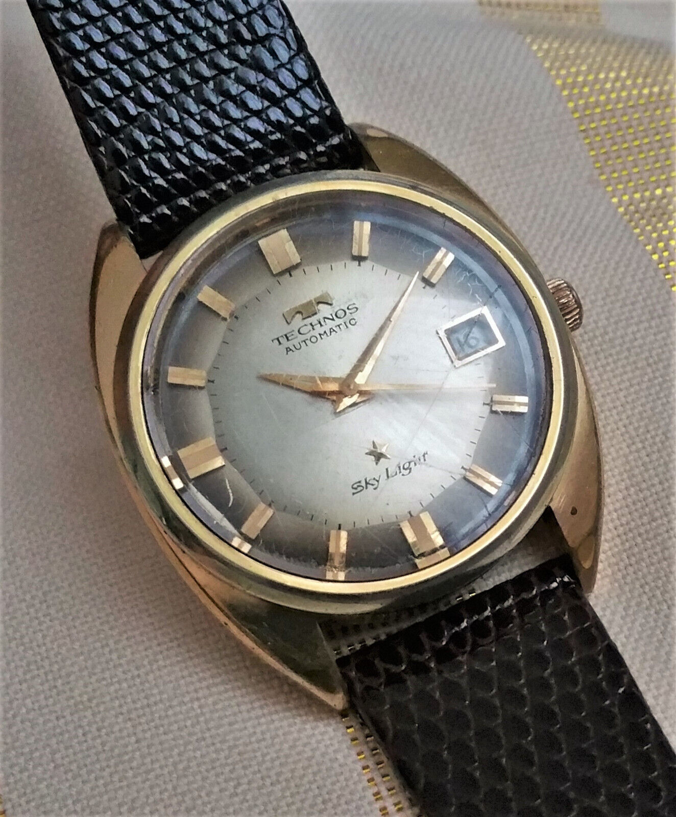 Vintage Swiss Technos Sky Light automatic watch, gold plated, pie