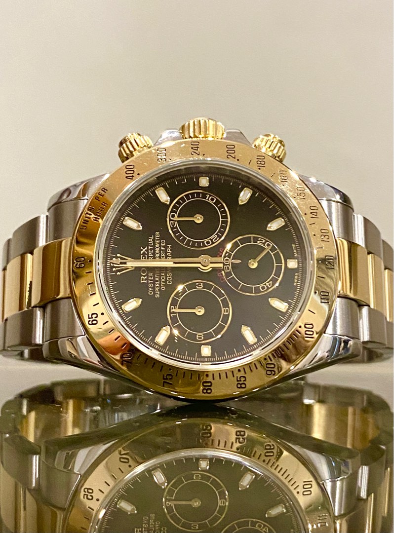 Rolex daytona clearance gold black face