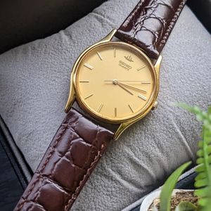 Vintage Mens Bulova T8 23mm Gold Tone Dress Watch CZ Marker