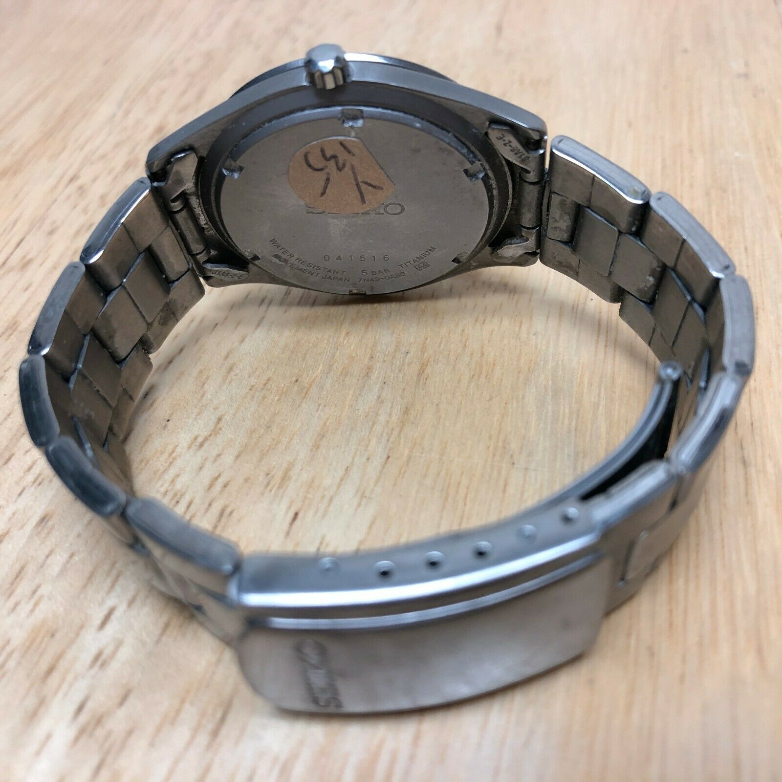 Seiko 7N43-0AB0 Mens 50m Titanium Analog Quartz Watch Hours~Day Date~New  Battery | WatchCharts