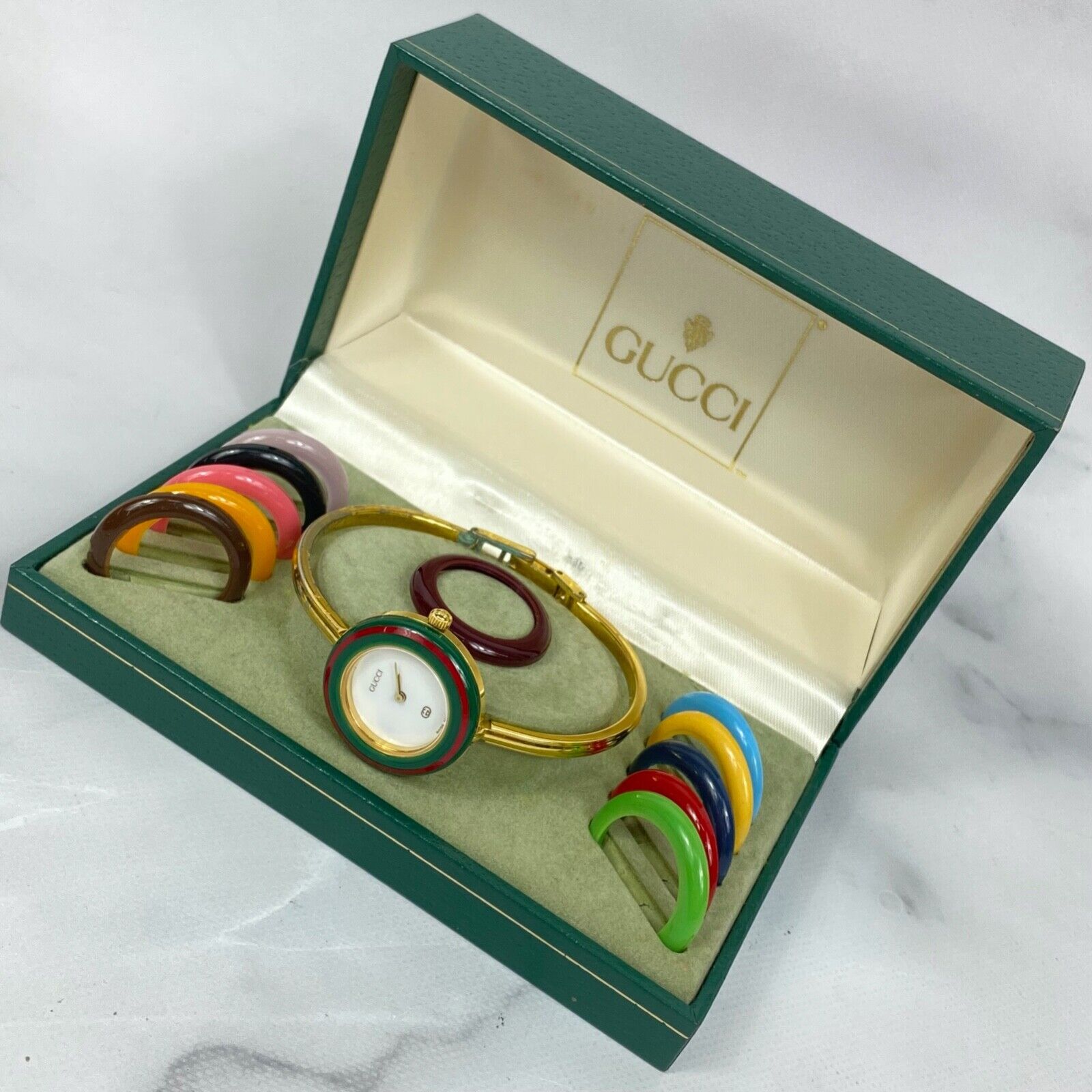 GUCCI 1100-L Interchangeable Bezels Gold Womens Watch With GUCCI 1100-L Interchangeable Bezels Gold Womens Watch With