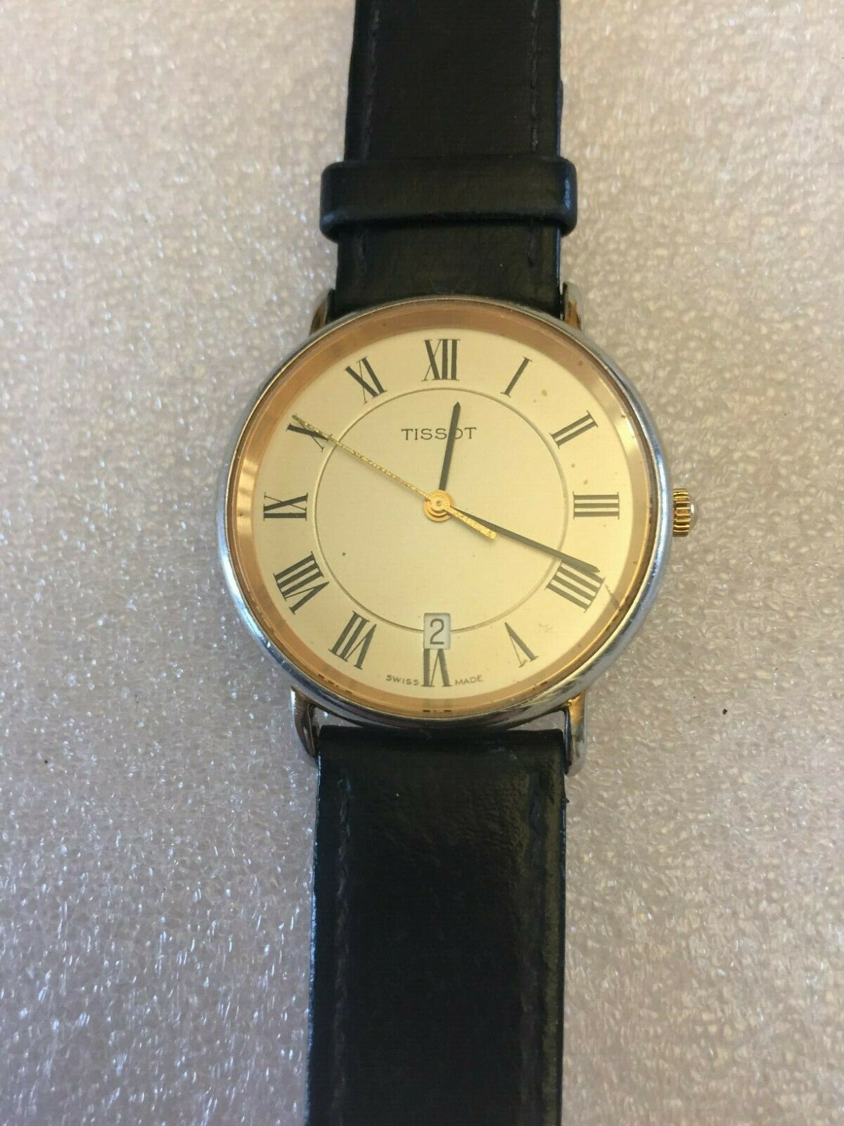 Vintage Tissot T882K mens wrist watch Roman Numerals date Circa