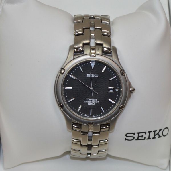 SEIKO Titanium 50M BLACK DIAL DATE Quartz Watch 7N32-0069 | WatchCharts ...