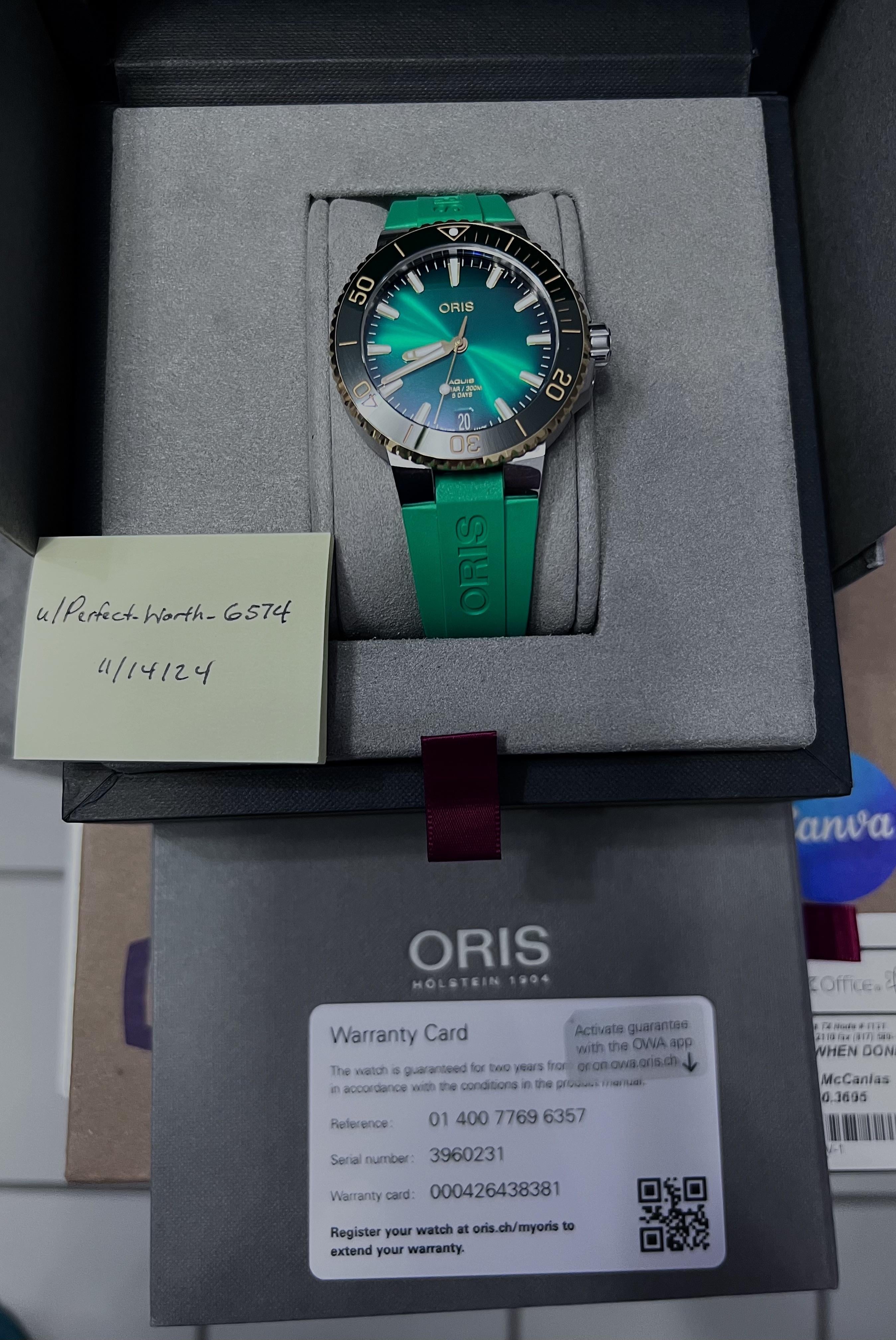 WTS Oris Aquis Date Cal 400 18K GOLD Bezel BRAND NEW 10 year warranty card 2400 WatchCharts Marketplace CA