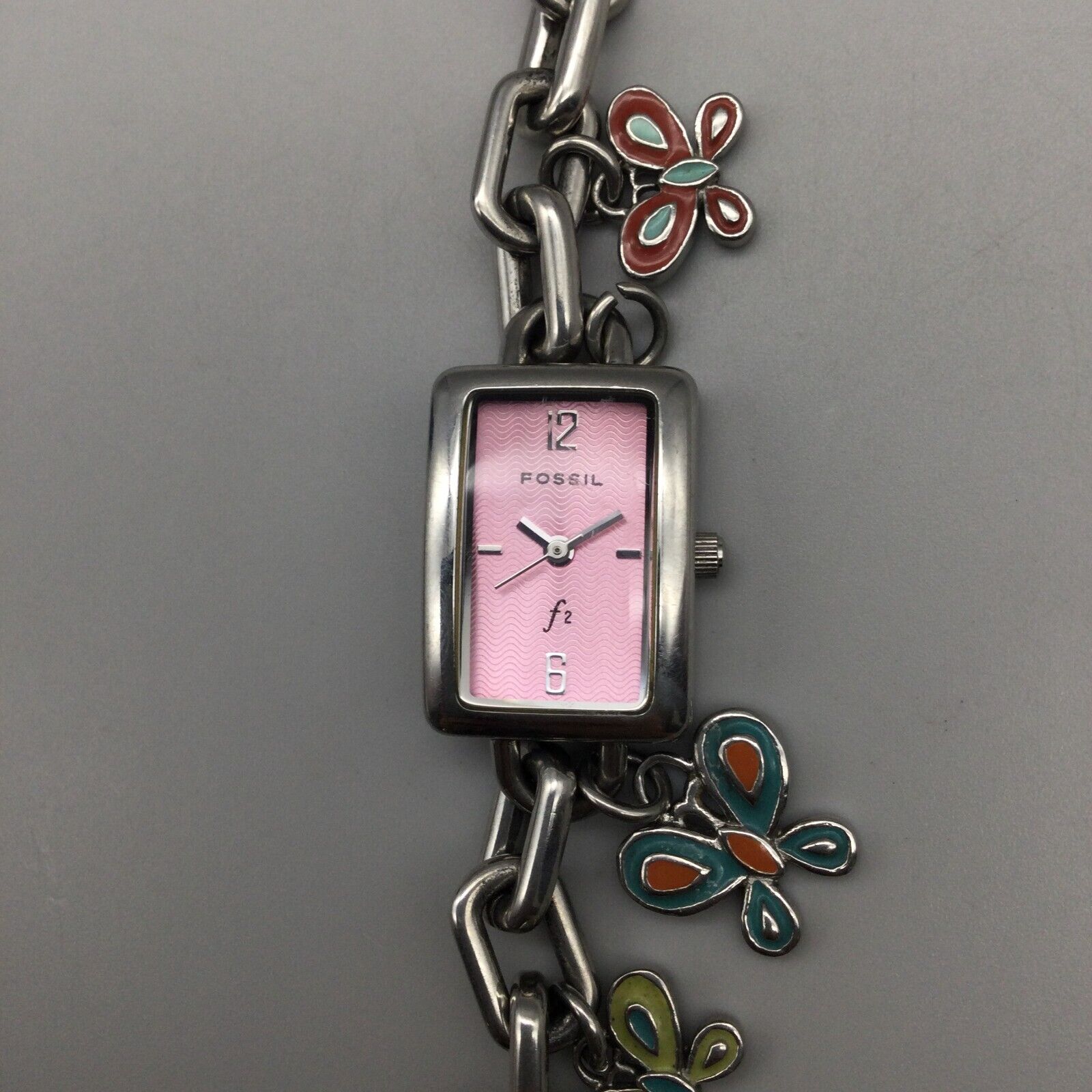 Fossil Charm Bracelet Watch Women Silver Tone Butterfly Pink Dial Battery 6.25 WatchCharts Marketplace